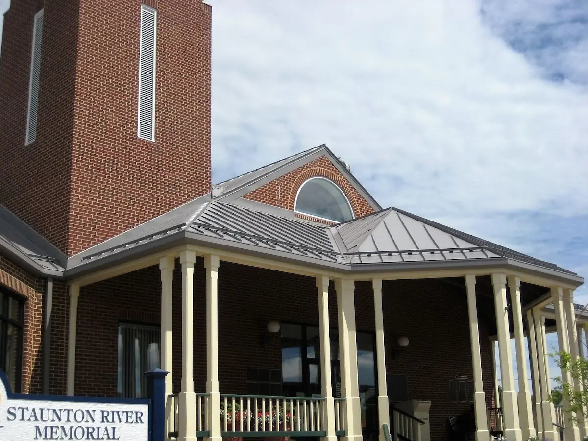 Skilled roofing craftsmen working on a residential roof in South Dover